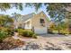 Exterior view of the garage and side of the house with a basketball hoop on the garage at 1511 Fairway Dr, Charleston, SC 29412