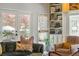 Cozy living room with natural light, comfortable seating, and a built-in bookshelf at 1511 Fairway Dr, Charleston, SC 29412