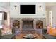 Inviting living room featuring a brick fireplace with decorative sconces and comfortable seating at 1511 Fairway Dr, Charleston, SC 29412