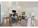 Bright, airy living room boasting high ceilings and a cozy seating area with a brick fireplace at 1511 Fairway Dr, Charleston, SC 29412