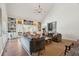 Open-concept living room with high ceilings, custom bookshelves, and comfortable seating arrangement at 1511 Fairway Dr, Charleston, SC 29412
