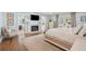 Bright main bedroom boasts a fireplace, hardwood floors, a sitting area, and access to the ensuite bathroom at 1511 Fairway Dr, Charleston, SC 29412