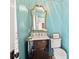 Stylish powder room with marble countertop, decorative mirror, and modern fixtures at 1511 Fairway Dr, Charleston, SC 29412