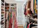 A fully stocked walk-in closet offers ample shelving and hanging space for all of your garments and accessories at 1511 Fairway Dr, Charleston, SC 29412