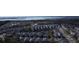 This beautiful aerial view showcases a community of homes around a scenic pond at 1513 Cultivation Ln, Mount Pleasant, SC 29466