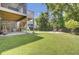 Expansive backyard featuring a lush lawn, outdoor seating, and mature trees for privacy and relaxation at 1513 Cultivation Ln, Mount Pleasant, SC 29466