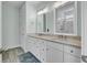 Double vanity bathroom features granite countertops, tile floors, and updated fixtures at 1513 Cultivation Ln, Mount Pleasant, SC 29466