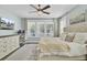 Bedroom featuring neutral décor, large windows, and a functional workspace setup with a modern desk at 1513 Cultivation Ln, Mount Pleasant, SC 29466