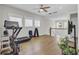 Bonus room features exercise equipment, a ceiling fan, and ample natural light from windows at 1513 Cultivation Ln, Mount Pleasant, SC 29466