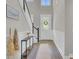 Bright entryway with hardwood floors, a console table, and a view of the staircase at 1513 Cultivation Ln, Mount Pleasant, SC 29466
