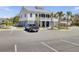 Modern building with a parking lot and mature trees, blending urban accessibility with natural charm at 1513 Cultivation Ln, Mount Pleasant, SC 29466