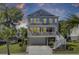 Charming exterior of a two-story home with a welcoming front porch and well-manicured landscaping at 1513 Cultivation Ln, Mount Pleasant, SC 29466
