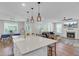 Bright, open-concept kitchen featuring a spacious island and seamless flow into the living area at 1513 Cultivation Ln, Mount Pleasant, SC 29466