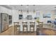 Modern kitchen with stainless steel appliances, a large island, and pendant lighting at 1513 Cultivation Ln, Mount Pleasant, SC 29466