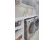 Well-organized laundry room featuring modern washer and dryer and ample storage at 1513 Cultivation Ln, Mount Pleasant, SC 29466
