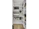 Custom built-in pantry shelving with plenty of storage space and wood floors at 1513 Cultivation Ln, Mount Pleasant, SC 29466