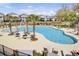 Large community pool with lounge chairs, tables, and lush landscaping at 1513 Cultivation Ln, Mount Pleasant, SC 29466