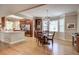 Sunlit dining area with stylish lighting and a view to the spacious kitchen with stainless appliances at 1551 Ben Sawyer Blvd # 44, Mount Pleasant, SC 29464