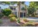 Beautiful home showcasing a 2-car garage, mature landscaping, and classic architectural details at 1551 Ben Sawyer Blvd # 44, Mount Pleasant, SC 29464