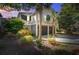 Charming home showcasing a 2-car garage, beautiful landscaping, and timeless coastal architecture at 1551 Ben Sawyer Blvd # 44, Mount Pleasant, SC 29464