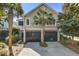Charming home featuring a 2-car garage, beautiful landscaping, and classic architectural design at 1551 Ben Sawyer Blvd # 44, Mount Pleasant, SC 29464