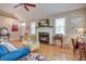 Inviting living room showcasing a fireplace, hardwood floors, and large windows for natural light at 1551 Ben Sawyer Blvd # 44, Mount Pleasant, SC 29464