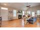 Bright living room featuring a cozy fireplace, hardwood floors, and ample natural light at 1551 Ben Sawyer Blvd # 44, Mount Pleasant, SC 29464