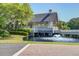 Charming waterfront gazebo with surrounding trees and foliage creating a peaceful waterside oasis at 1551 Ben Sawyer Blvd # 44, Mount Pleasant, SC 29464