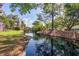 Picturesque water view with a wooden bridge and lush greenery, perfect for relaxation and enjoying nature's beauty at 1551 Ben Sawyer Blvd # 44, Mount Pleasant, SC 29464