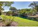 Scenic view of a wooden bridge crossing a serene waterway surrounded by lush greenery and trees at 1551 Ben Sawyer Blvd # 44, Mount Pleasant, SC 29464