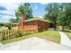 Brick home with fenced backyard and walkway at 1915 Aichele Dr, North Charleston, SC 29406