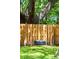 Backyard tire swing hanging from a mature tree, creating a fun and nostalgic play area at 1915 Aichele Dr, North Charleston, SC 29406