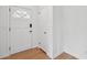 Entryway featuring beautiful white wood paneling, a front door, and storage closet at 1915 Aichele Dr, North Charleston, SC 29406