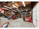 Spacious garage with workbench, motorcycle, tools, and overhead lighting for ample storage and workspace at 1915 Aichele Dr, North Charleston, SC 29406