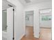 Hallway leading to bedrooms and bathroom with light hardwood floors at 1915 Aichele Dr, North Charleston, SC 29406
