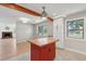 Bright kitchen with a center island, white cabinets, natural light, and wood beam at 1915 Aichele Dr, North Charleston, SC 29406