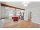 Bright kitchen features white cabinets, stainless steel appliances, an island with butcher block top, and a decorative wood beam at 1915 Aichele Dr, North Charleston, SC 29406