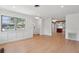 Bright living room with hardwood floors, modern lighting, and open view to the kitchen at 1915 Aichele Dr, North Charleston, SC 29406