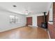 Living room with a wood-burning stove, brick accent wall, and natural lighting at 1915 Aichele Dr, North Charleston, SC 29406