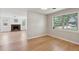 The living room offers hardwood floors, crisp neutral paint, and a glimpse into the cozy Gathering room with its charming fireplace at 1915 Aichele Dr, North Charleston, SC 29406