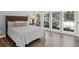 Light-filled bedroom with wood floors and a bay window overlooking the backyard at 1918 Armory Dr, Mount Pleasant, SC 29466