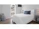 Serene bedroom with white furniture, arched window, and inviting decor with a splash of blue at 1918 Armory Dr, Mount Pleasant, SC 29466