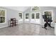 Bonus room with vaulted ceilings, tiled floors, a home exercise bike, and access to the backyard at 1918 Armory Dr, Mount Pleasant, SC 29466