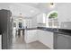 Bright kitchen featuring white cabinetry, granite countertops, stainless steel appliances, and tile flooring at 1918 Armory Dr, Mount Pleasant, SC 29466