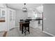 Bright kitchen with a dining table, tile flooring, white cabinets, and black countertops at 1918 Armory Dr, Mount Pleasant, SC 29466