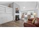 Bright living room features vaulted ceiling, built-in shelving and luxury vinyl plank flooring at 1918 Armory Dr, Mount Pleasant, SC 29466