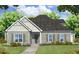 Charming home with a well-manicured lawn, gray siding, and complementing trim at 1956 Central Ave, Summerville, SC 29483