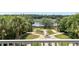 Overhead view of a backyard featuring a fountain and verdant foliage for relaxing and scenic enjoyment at 1972 Long Creek Rd, Wadmalaw Island, SC 29487