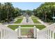 Overlooking brick pathway leading to water fountain and lake at 1972 Long Creek Rd, Wadmalaw Island, SC 29487