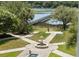 Water fountain surrounded by walkway overlooking the lake in the backyard at 1972 Long Creek Rd, Wadmalaw Island, SC 29487